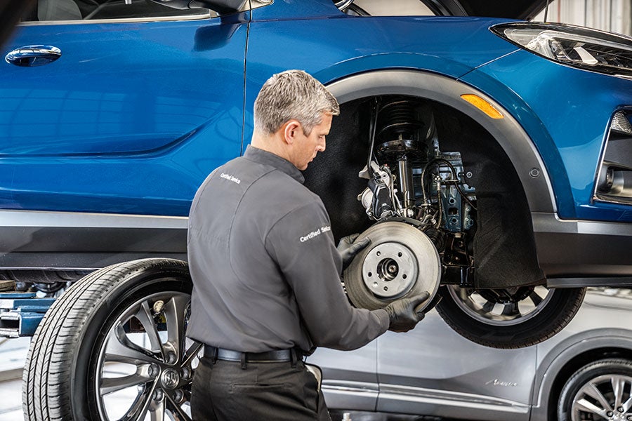 Service employee working on a car