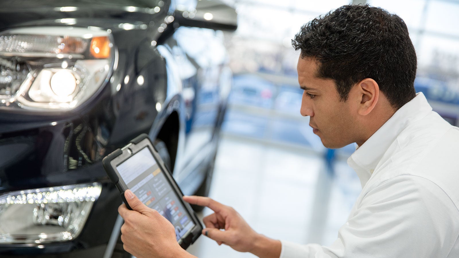 Service employee working on a car